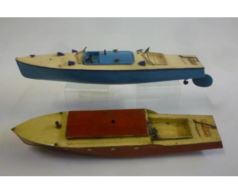 A Hornby Speedboat, tinplate, clockwork powered, cream deck, blue hull, one of two windscreens present, 18" long, and another