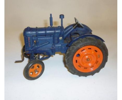 A Chad Valley Fordson Tractor, diecast, dark blue, orange hubs, rubber tyres, clockwork, 7 1/2" long, G, later box