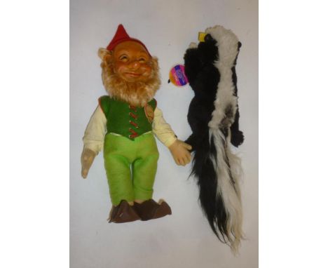 A Steiff "Lucki" bearded gnome with composition head and felt outfit, 12" high, and a Steiff Cosy Skunk, 16" overall, both wi