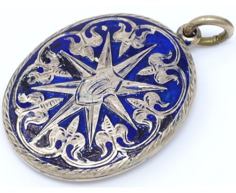 A yellow metal and blue enamel mourning pendant, with hair panel back, height excluding bale 37mm, 9.5g 