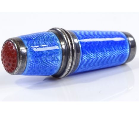 A Continental silver and blue guilloche enamel thimble / needle case, with engine turned decoration and carnelian thimble tip