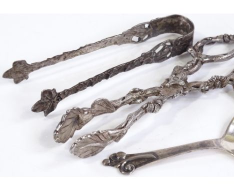 A pair of unmarked silver sugar nips, together with a pair of Swedish silver tongs, and a Danish silver caddy spoon (3) 