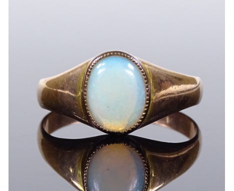 An 8ct gold cabochon white opal signet ring, setting height 9.4mm, size N, 2.2g 