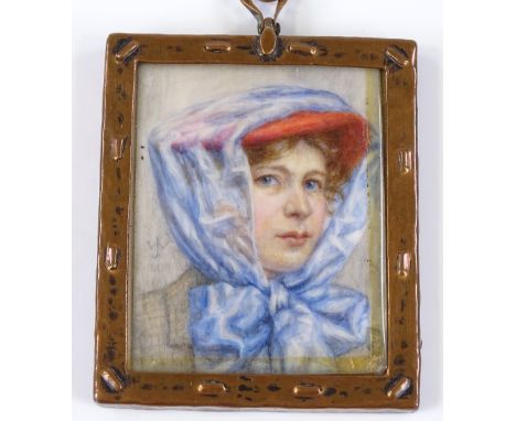 An Edwardian miniature watercolour, portrait of a lady motorist, signed with monogram, dated 1906, in embossed copper frame, 