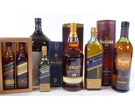 7 bottles of whisky, including Glenfidditch 21 year old, Chivas Revolve, Johnny Walker Blue label, Dewars 12 year old, and 3 