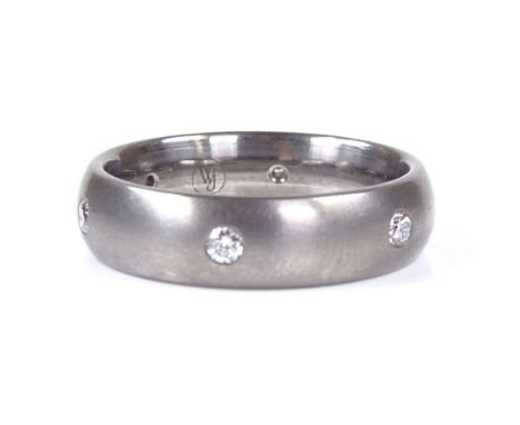 A brushed titanium diamond wedding band ring, total diamond content approx 0.25ct, maker's marks WJ, band width 6mm, size T, 