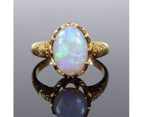 An 18ct gold cabochon opal dress ring, setting height 12.6mm, size L, 3.5g 