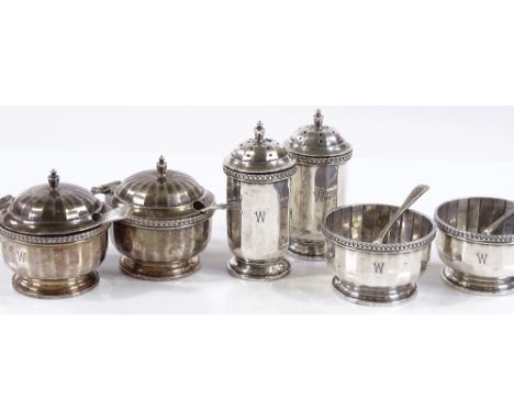 A set of 6 circular cruets, including condiments, salts and pepperettes, by Walker &amp; Hall, hallmarks Birmingham 1927, 6.5