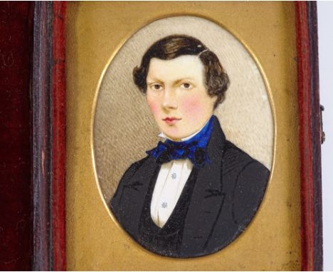 A 19th century miniature watercolour portrait of a gentleman, in original red leather case, case height 8cm 