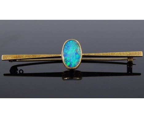 A 15ct gold black opal bar brooch, panel height 13.8mm, brooch length 60mm, 3.7g (opal chipped) 