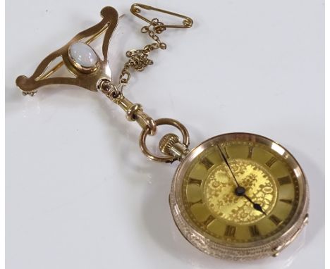 A 9ct gold open-face top-wind fob watch, with floral engraved case and face, case no. 101168, case width 30mm, working order,