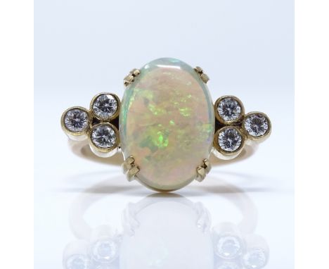 An unmarked gold white opal and diamond dress ring, setting height 12.7mm, size L, 3.2g 