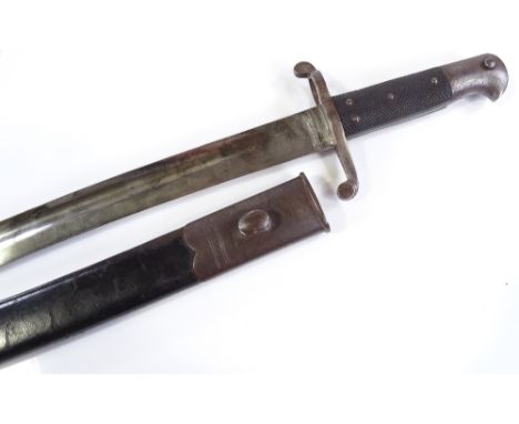 A late 19th century sword bayonet, overall length 71cm, original metal-mounted leather scabbard 