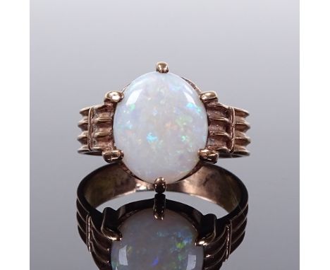 A 9ct gold cabochon opal ring, setting height 13.8mm, size M, 3.5g 