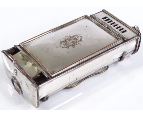 A silver plate on copper coach lantern, with integral stand and candle holder, length 15cm 