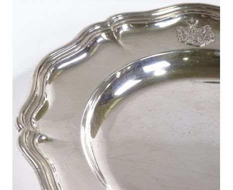 An Austrian Imperial circular silver card tray / salver, with scalloped border and cast-silver armorial coat of arms, bearing