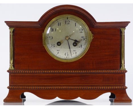 An Edwardian mahogany-cased mantel clock, with brass columns, silvered dial, and 8-day striking movement, case width 30cm 