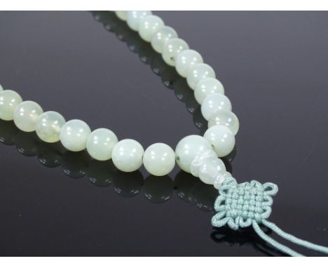A single string of polished jade beads, length 520mm 