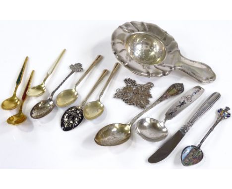 Silver and enamel teaspoons, a silver tea strainer etc 