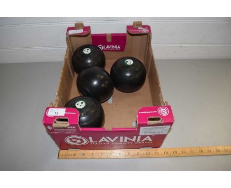 FOUR VINTAGE LAWN BOWLS