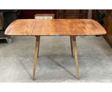 An Ercol dropleaf dining table. 53" long.