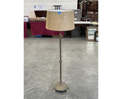 A brass telescopic lamp standard.