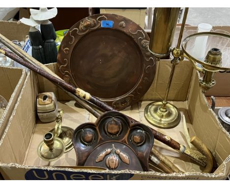 An Arts and Crafts copper dish; a brass oil lamp; chamberstick; three walking canes etc.