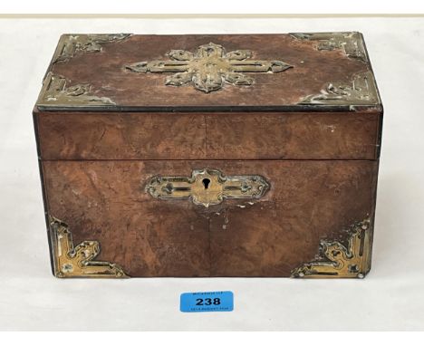 A Victorian walnut tea caddy with brass mounts and escutcheon. 9¼" wide.