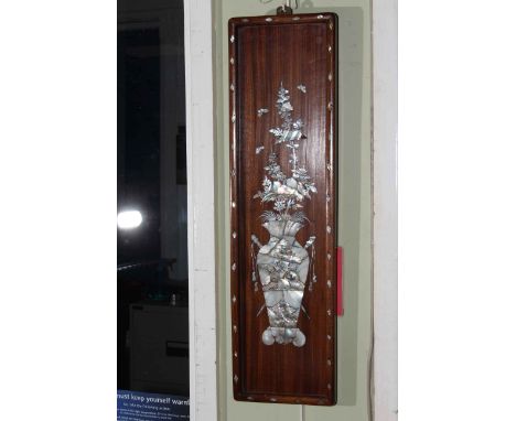 Pair Oriental rosewood and mother of pearl inlaid wall plaques depicting vases of flowers, 61cm by 16.5cm.