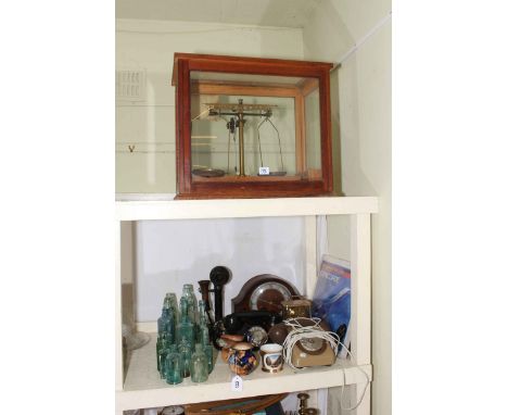 Balance scales, mantel clock, telephones, glass bottles, sign, etc.