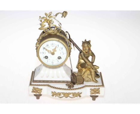 Gilt metal mounted marble mantel clock with cherub figure.