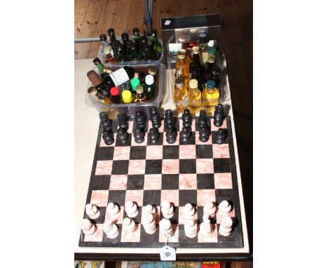 Marble chess set and board, and collection of spirit miniatures.