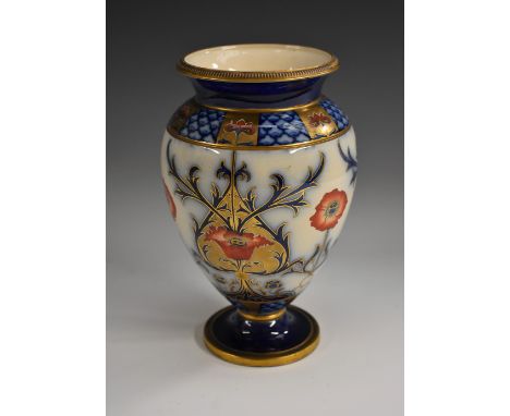 A Moorcroft McIntyre baluster shaped vase, decorated with stylised poppies and foliage, in red, blue and gilt, the shoulders 