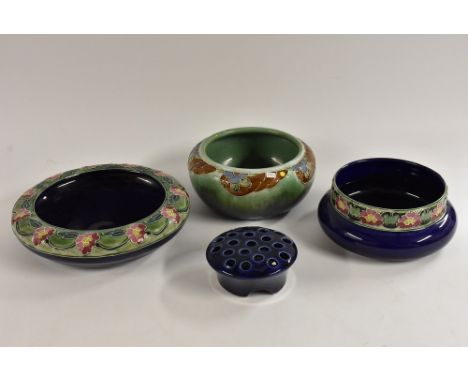 A Bourne Denby tube lined shallow bowl, decorated with a band of colourful flowers, 28cm diameter, c.1900; a tube lined recta