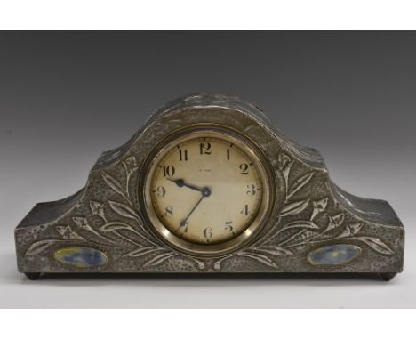 An Arts and Crafts mantel clock, the pewter case decorated with stylised repousse leaves, Ruskin style oval pottery cabochons