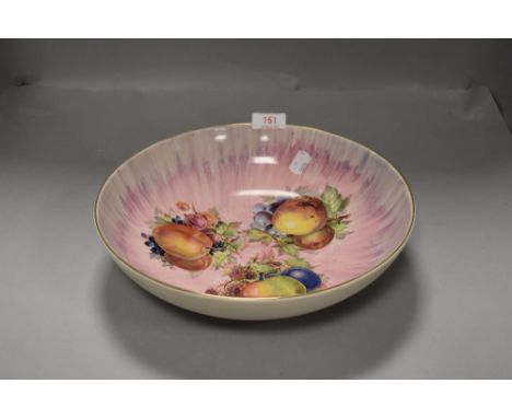 A large fruit bowl having print of plums peaches and apples by Clarice Cliff Royal Staffordshire