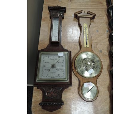Two vintage wall mounted barometers, one having carved detail by Fowler and Oldfield of Bradford.AF