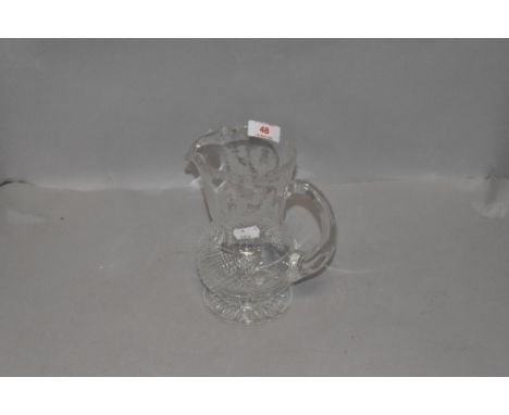 A water jug or decanter by Edinburgh crystal in a Scotch thistle design