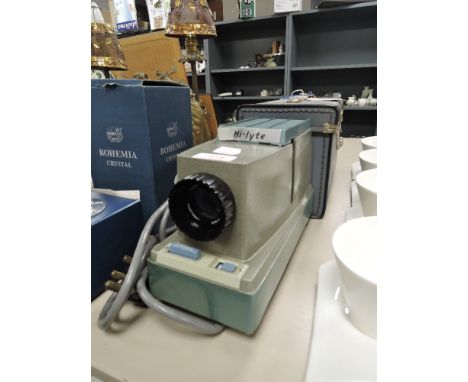 A vintage Hi-Lyte slide projector with case.