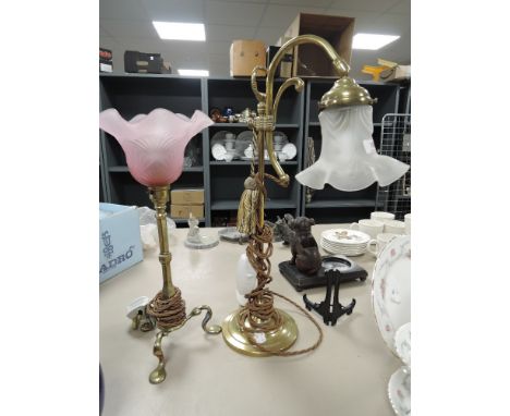 Two brass lamps, one Railway lamp with pink shade having LMR stamped to foot,the other A library lamp with adjustable neck.
