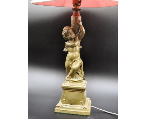 Table lamp, sculptured cherub holding a vase signed C Paul 37cm tall