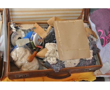 Suitcase of upholsterers tools and materials