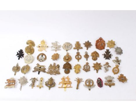 Group of forty British military cap badges to include Duke of Cornwalls Light Infantry, Wiltshire Regiment and Royal Engineer