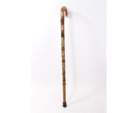 Wooden Walking stick, mounted with various British military cap badges, together with a Soviet Military cap (2)