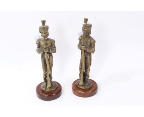 Pair of brass military figures of Riflemen, mounted on wooden plinth bases, each approx. 31.5cm in height