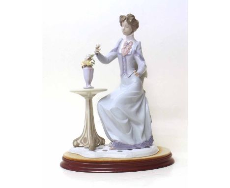 Lladro lady and vase of flowers Condition report: see terms and conditions