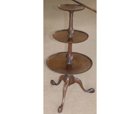 George III style mahogany circular graduated three tier dumbwaiter on tripod base. Condition report: see terms and conditions