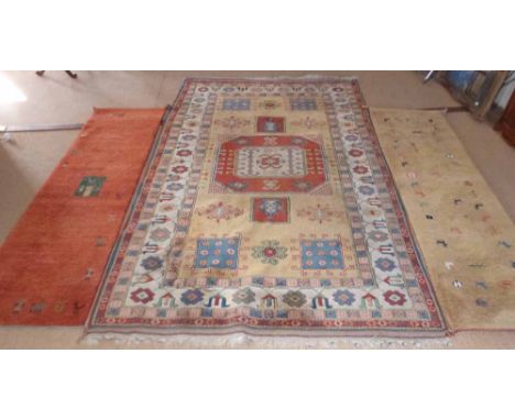 Middle Eastern carpet and 2 rugs Condition report: see terms and conditions