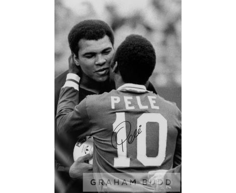 Pele signed b&w photographic print with Muhammad Ali, featuring two of the 20th century greatest sporting legends embracing o