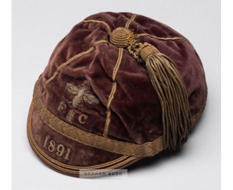 Football representative cap 1891, the dark red velvet cap with gilt braiding and tassels, embroidered the bee club emblem FC 